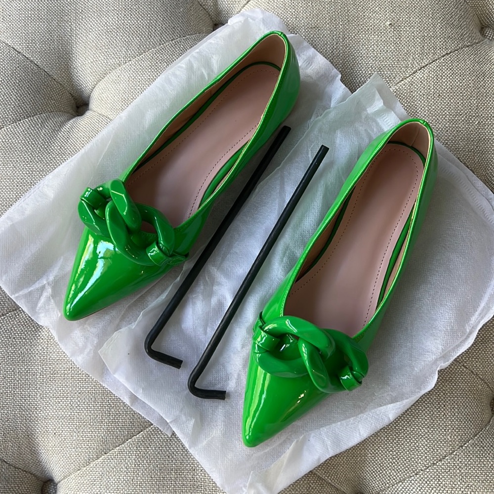Gorgeous green flats with oversized detail.